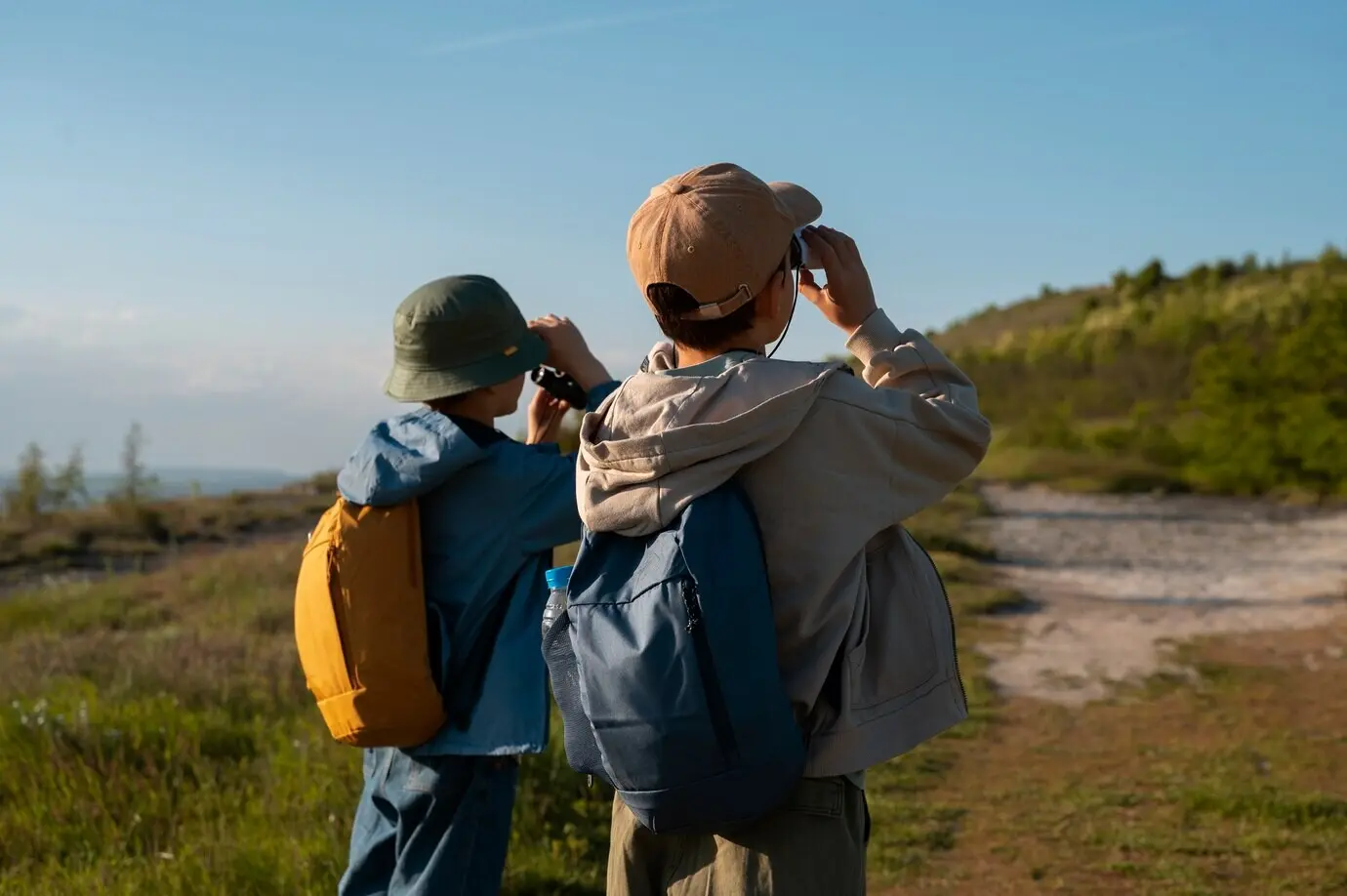 Medium shot of children exploring the natural environment.